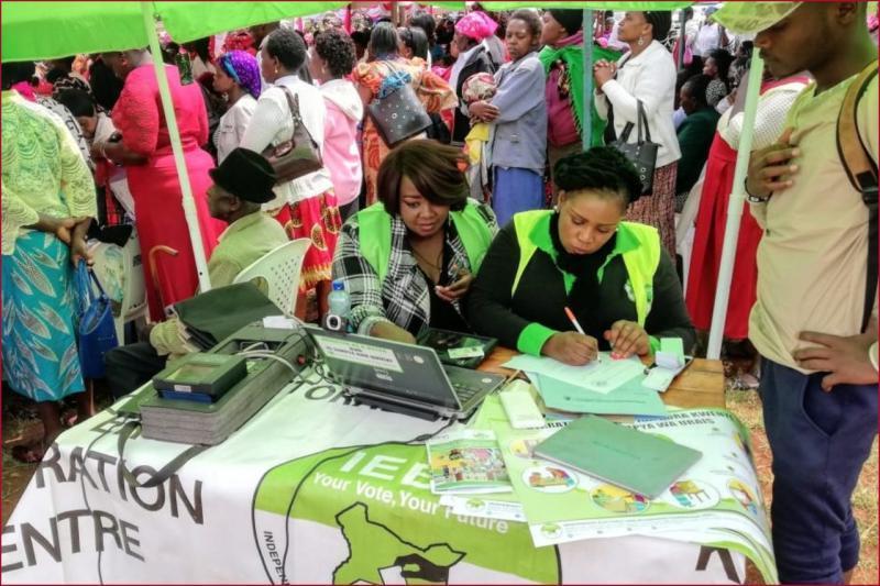 IEBC officials in a past drive to enlist voters.